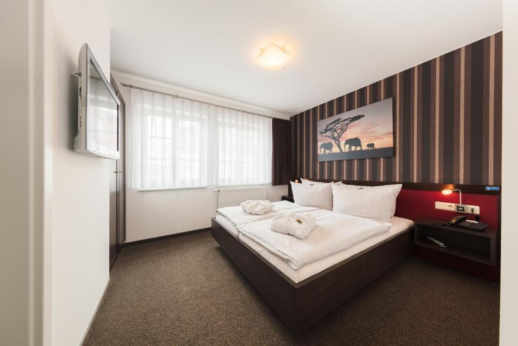 Voodi või voodid majutusasutuse Hotel Mühlhäuser Hof toas