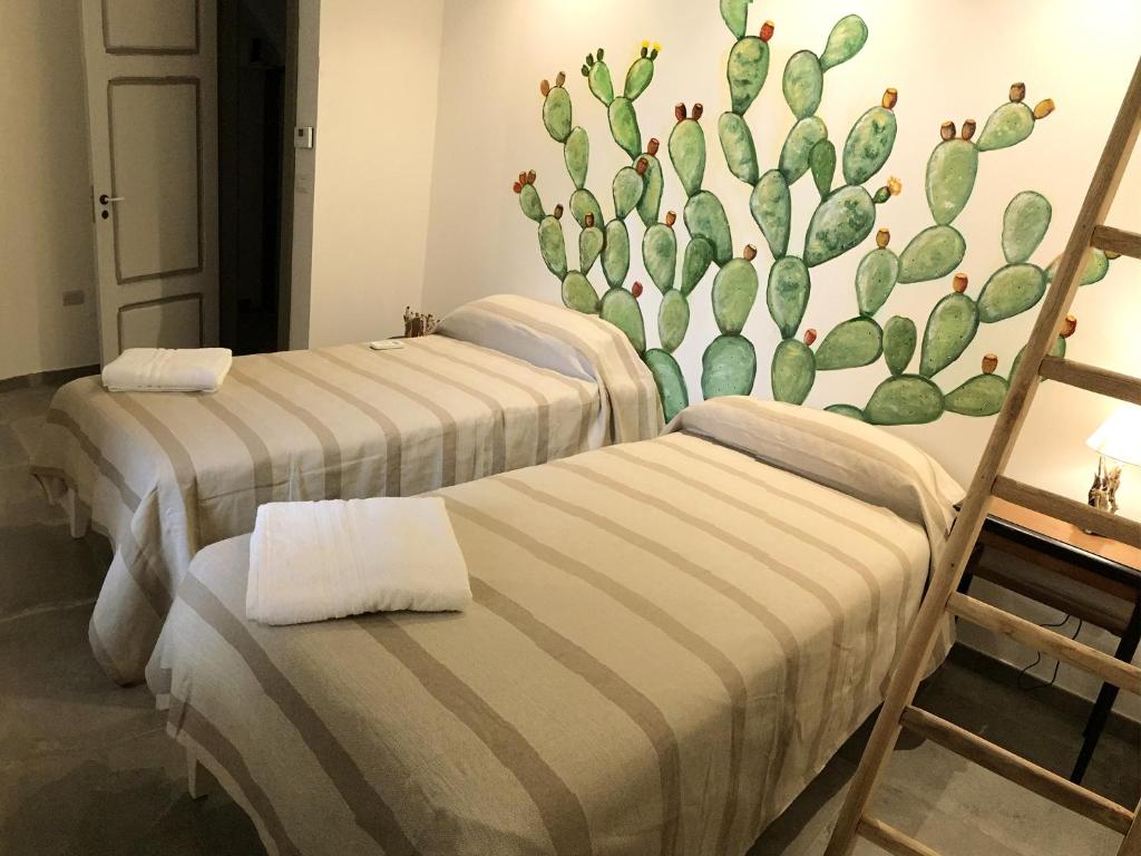 Postel nebo postele na pokoji v ubytování Le Luminarie B&B