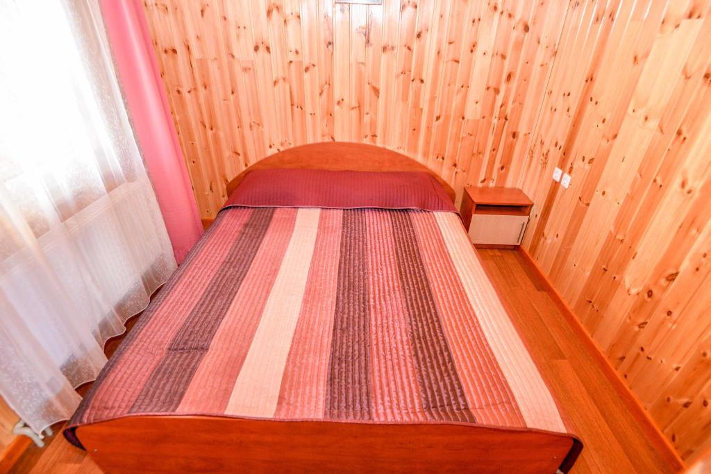 Postel nebo postele na pokoji v ubytování Sodyba Džiugutis