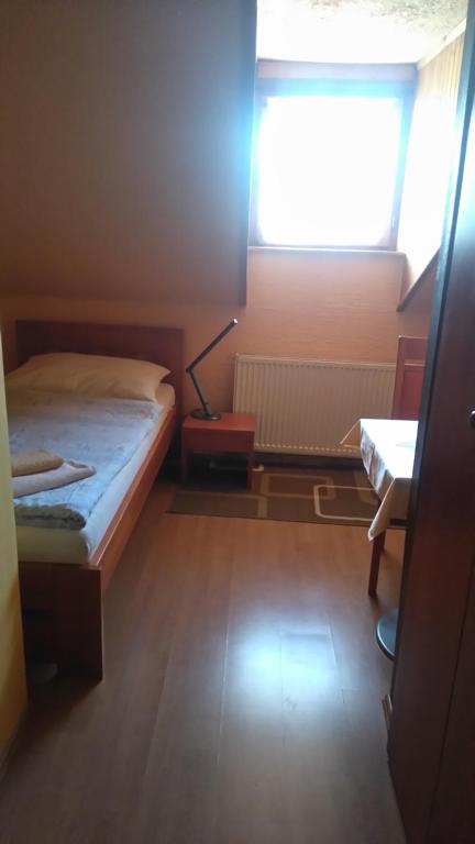 Postel nebo postele na pokoji v ubytování Šestajovický pivovar ubytování