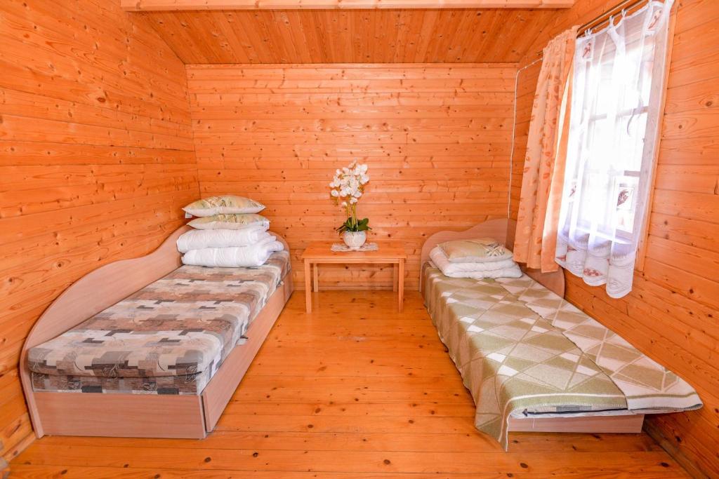Postel nebo postele na pokoji v ubytování Sodyba Džiugutis