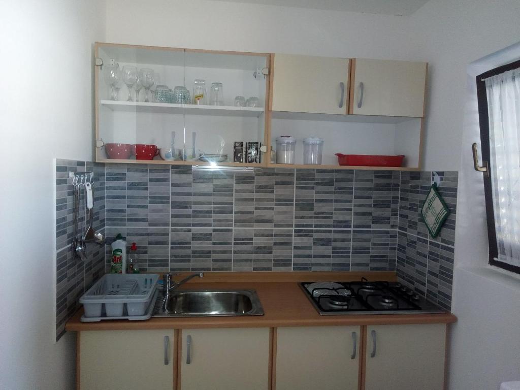 Kuchyňa alebo kuchynka v ubytovaní Apartments Banoci
