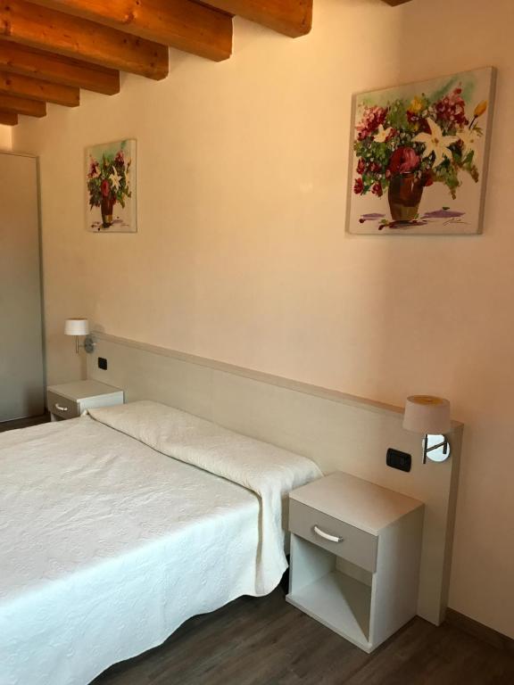 Posteľ alebo postele v izbe v ubytovaní Residence Eremitani