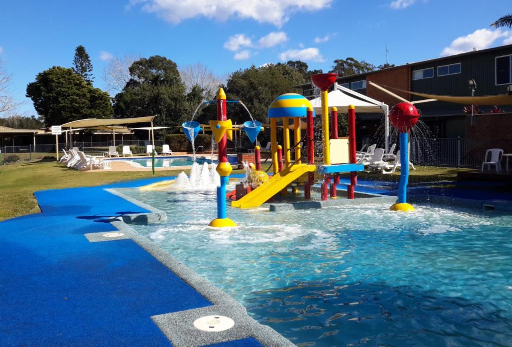 a water park with a slide in the water at Tuncurry Lakes Resort in Tuncurry