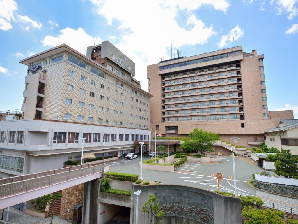 a city with two tall buildings and a street at Grand Hotel Hamamatsu in Hamamatsu