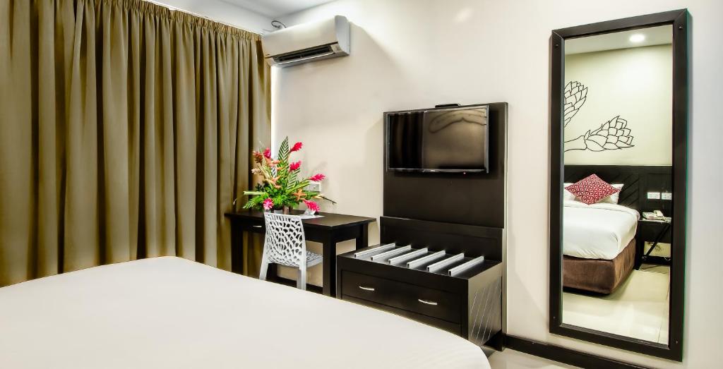 Postel nebo postele na pokoji v ubytování Tanoa Rakiraki Hotel
