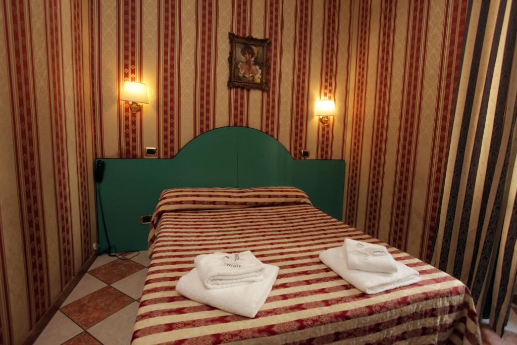 Postel nebo postele na pokoji v ubytování Hotel Hollywood