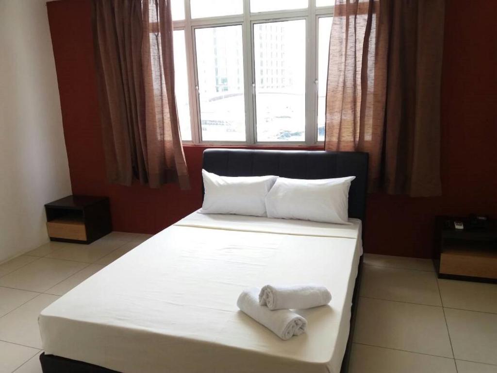 Postel nebo postele na pokoji v ubytování T-Hotel Ipoh