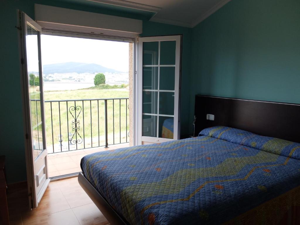 Postel nebo postele na pokoji v ubytování A Carballeira