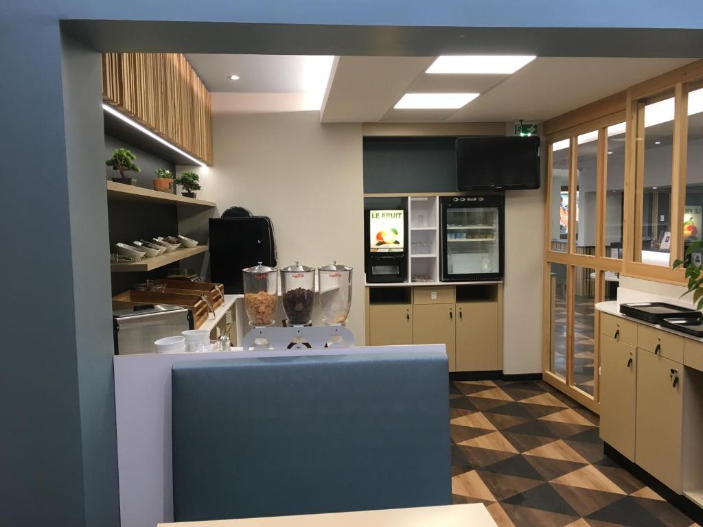 Kuchyň nebo kuchyňský kout v ubytování Hôtel Icare