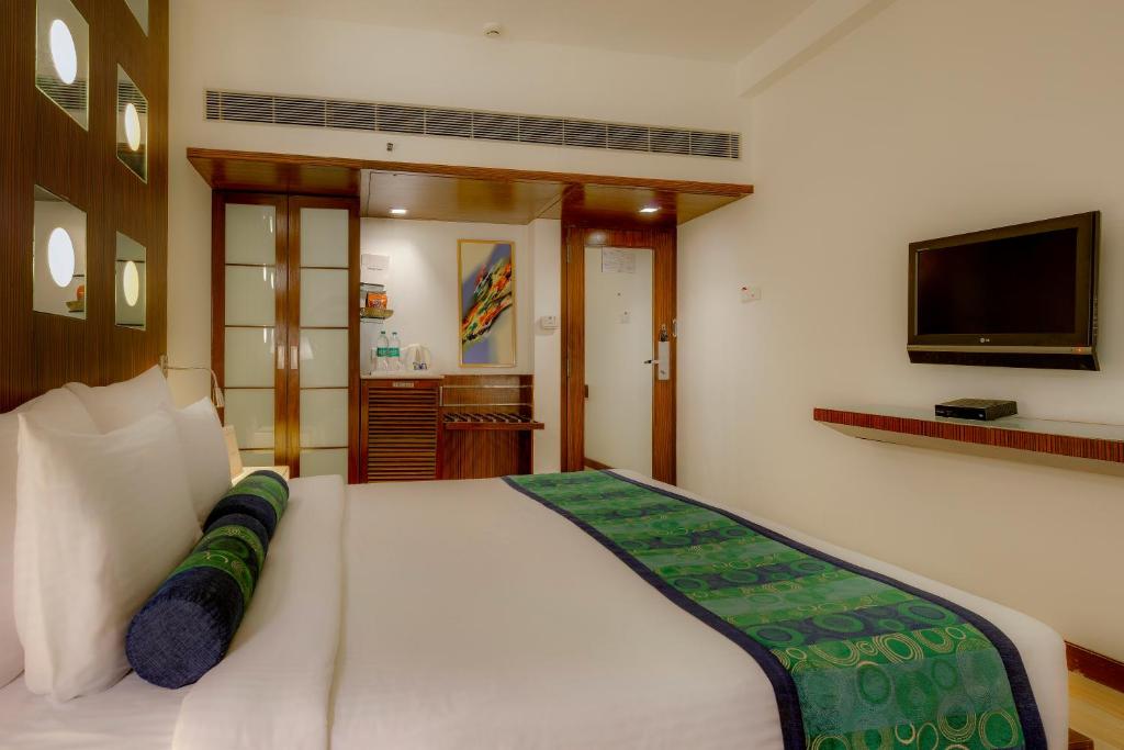 Postel nebo postele na pokoji v ubytování Pride Hotel, Chennai