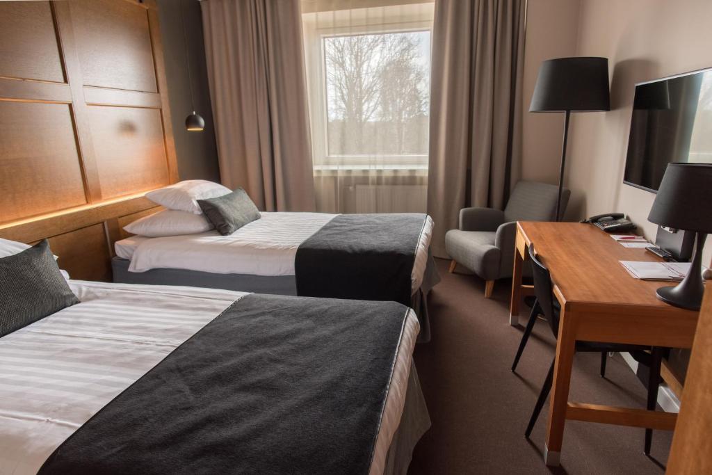 Postel nebo postele na pokoji v ubytování Original Sokos Hotel Vaakuna Joensuu