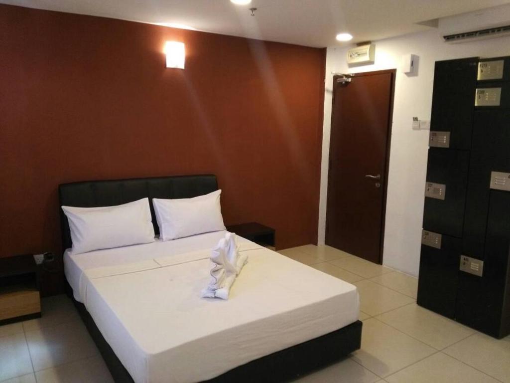 Postel nebo postele na pokoji v ubytování T-Hotel Ipoh