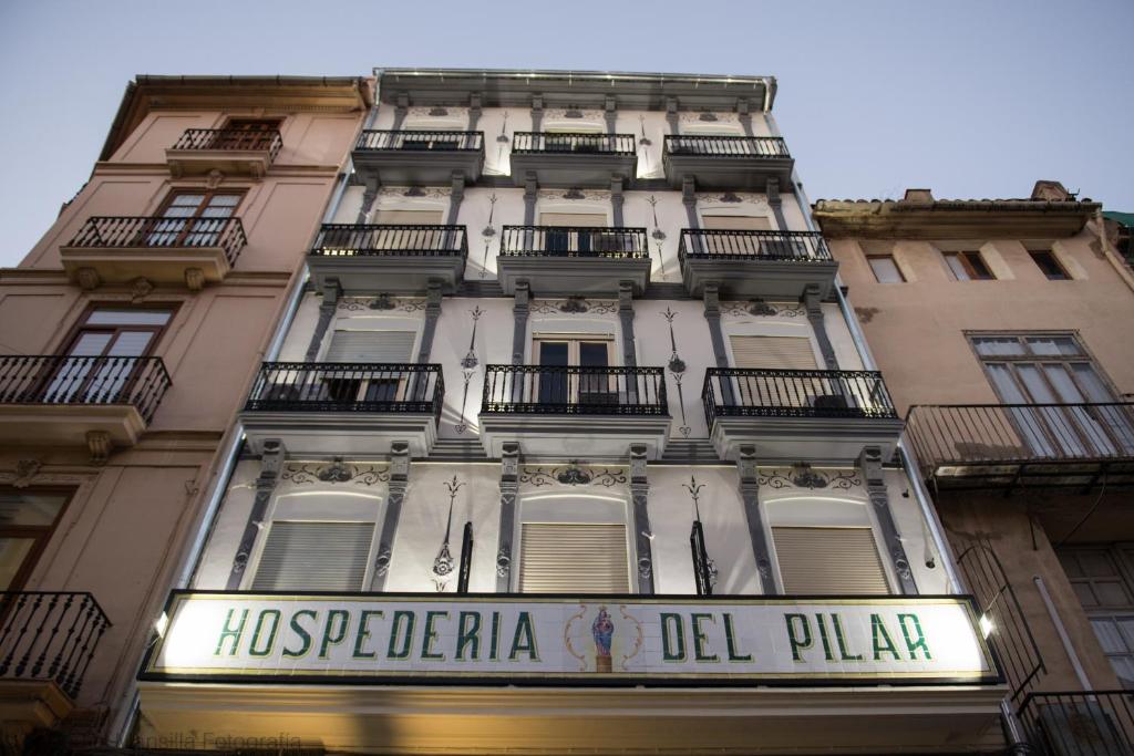 
a building with a sign on the side of it at Hospederia del Pilar in Valencia
