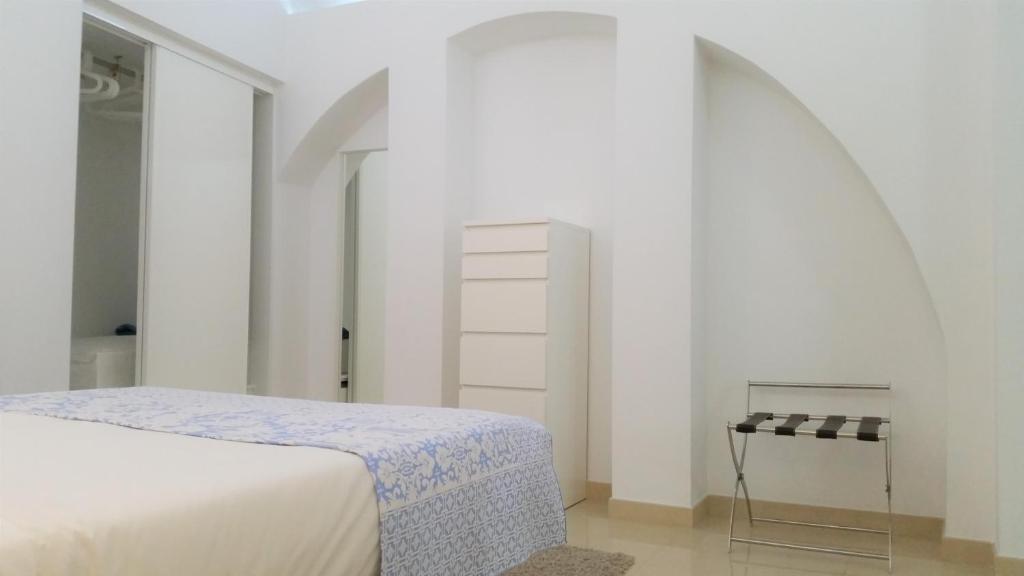 Postel nebo postele na pokoji v ubytování Ebora Home - GARAGE free - Centro Histórico
