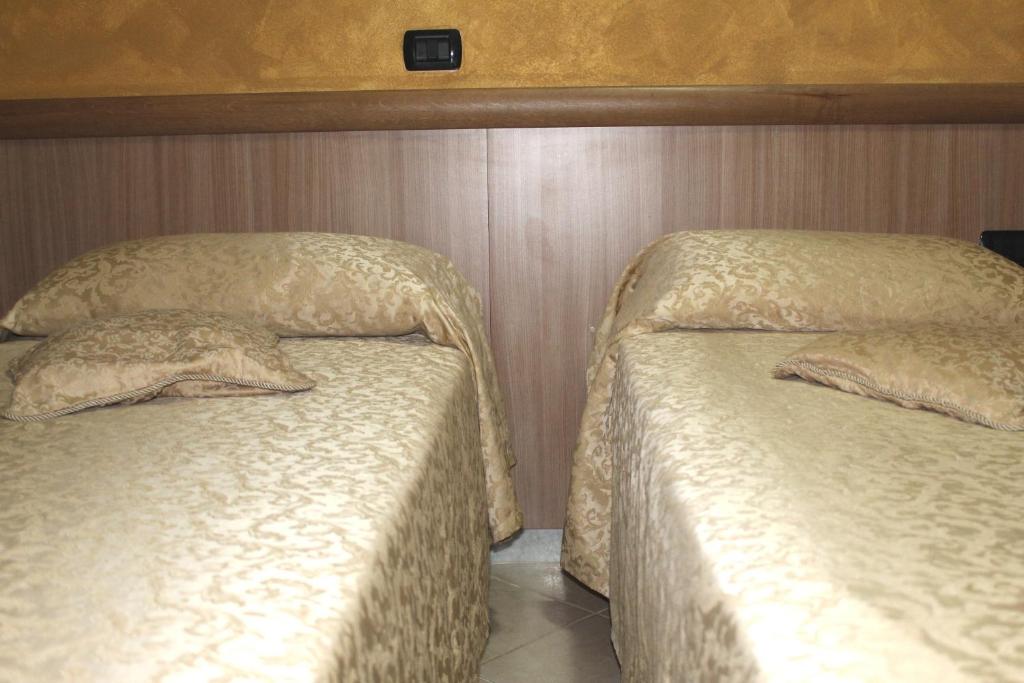 Postel nebo postele na pokoji v ubytování Albergo Posta