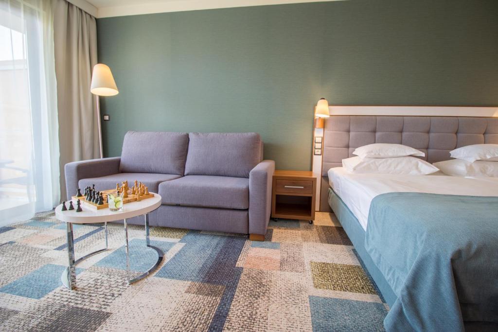Postel nebo postele na pokoji v ubytování Hotel Aquarius SPA