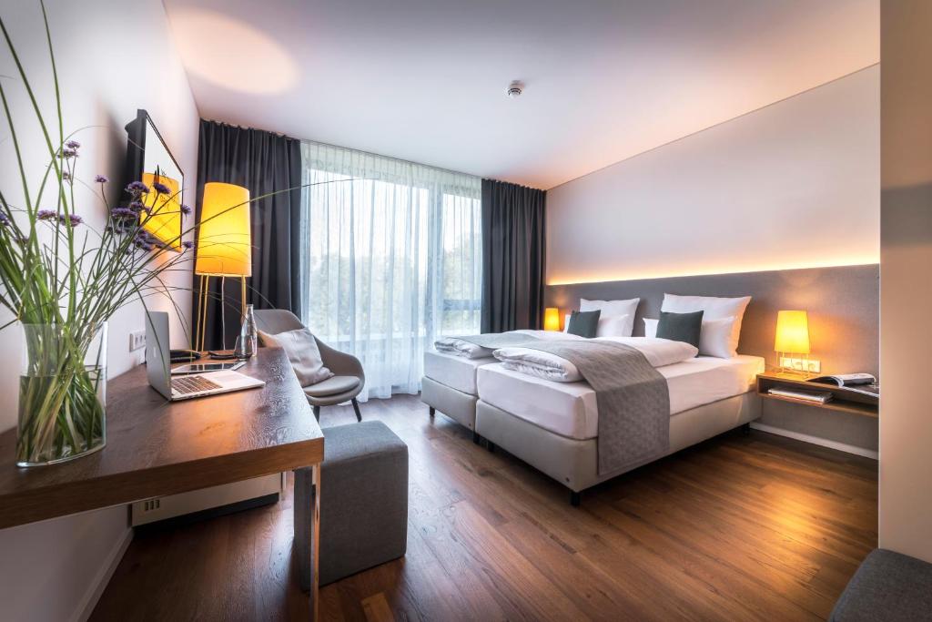 Postel nebo postele na pokoji v ubytování Hotel Melchior Park