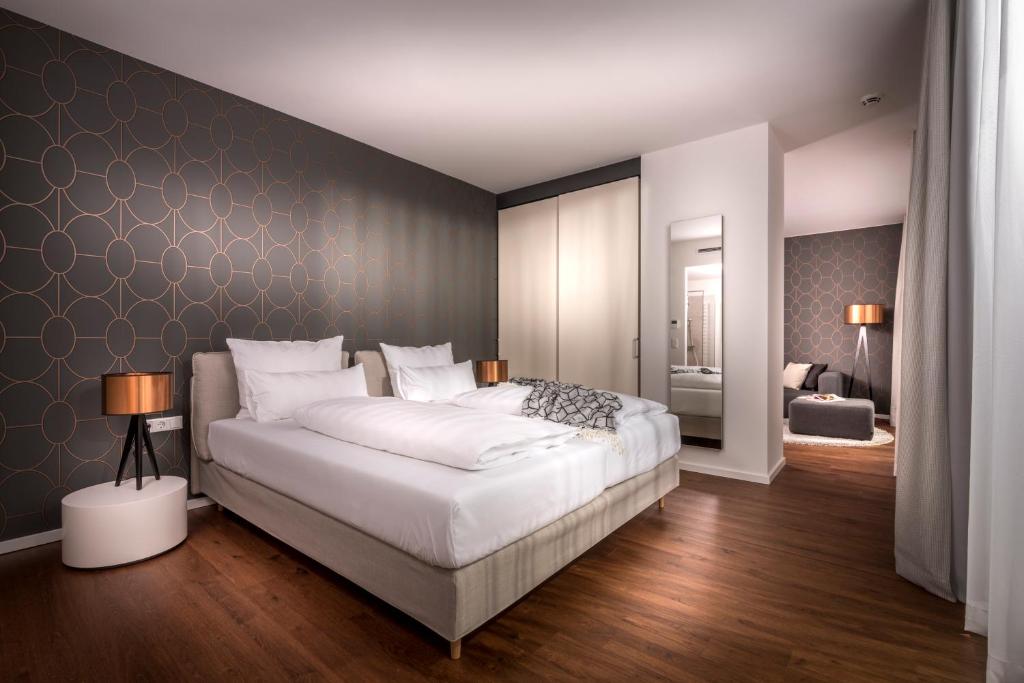 Postel nebo postele na pokoji v ubytování Hotel Melchior Park
