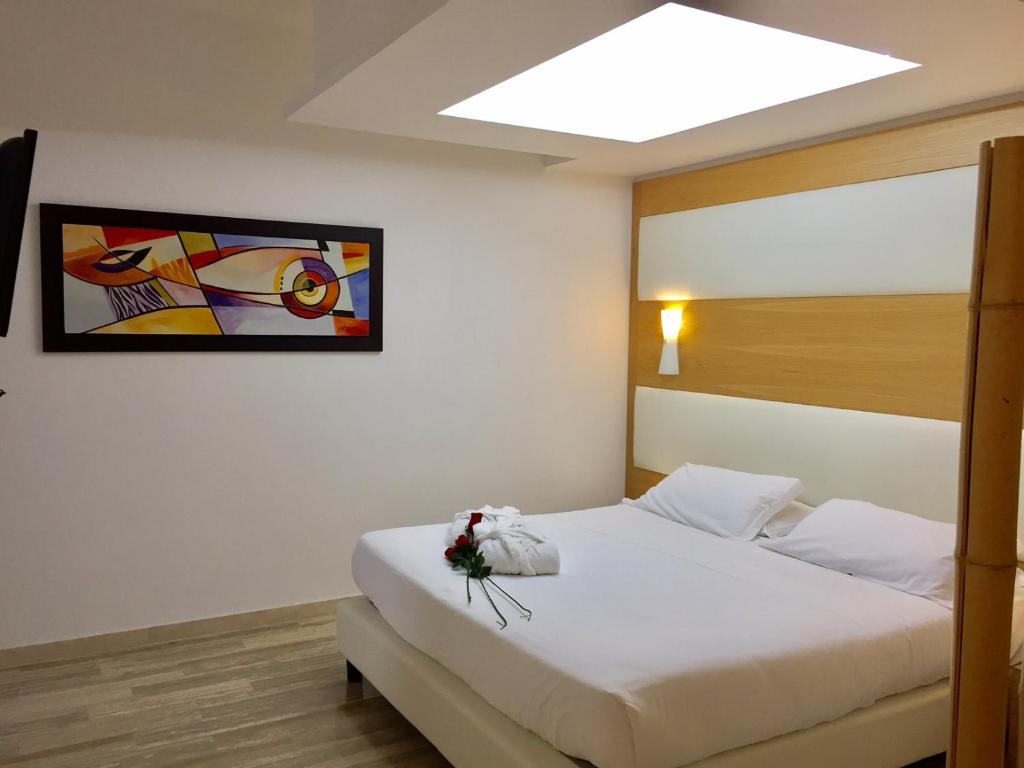 Postel nebo postele na pokoji v ubytování Hotel Sant'Elia
