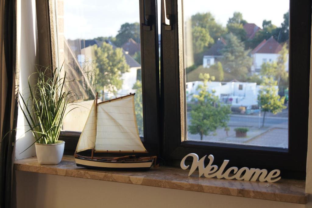 a model boat sitting on a window sill at Apartment Nordenham in Nordenham