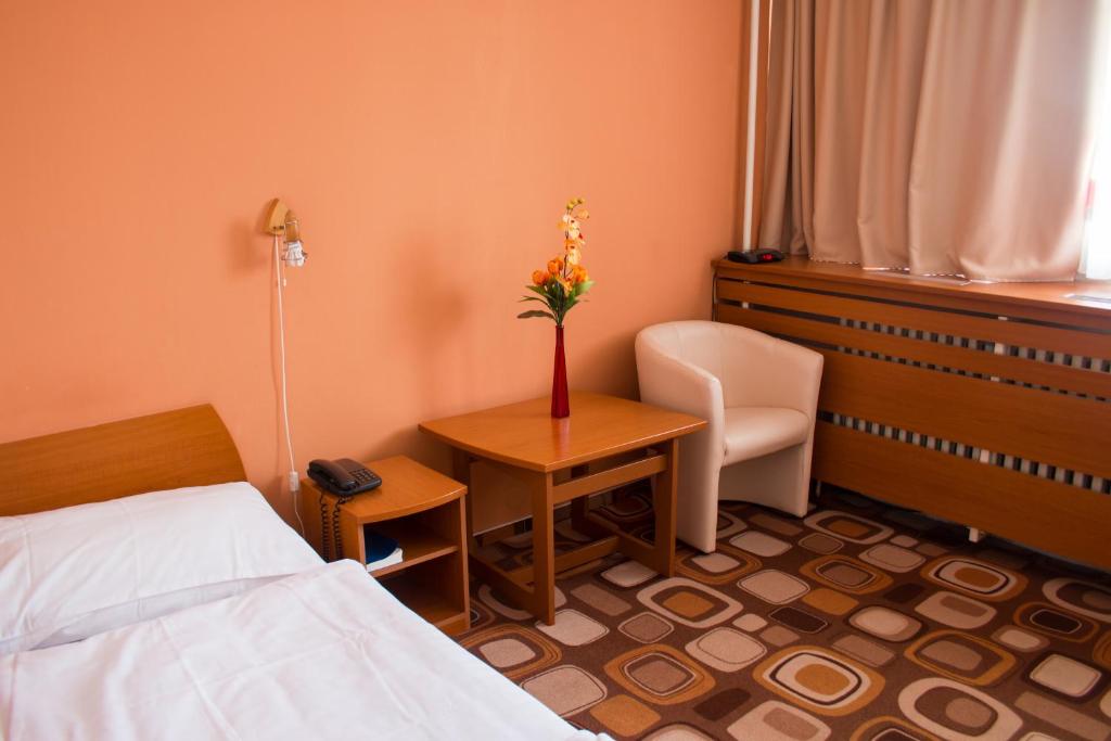 Postel nebo postele na pokoji v ubytování Hotel Druzba