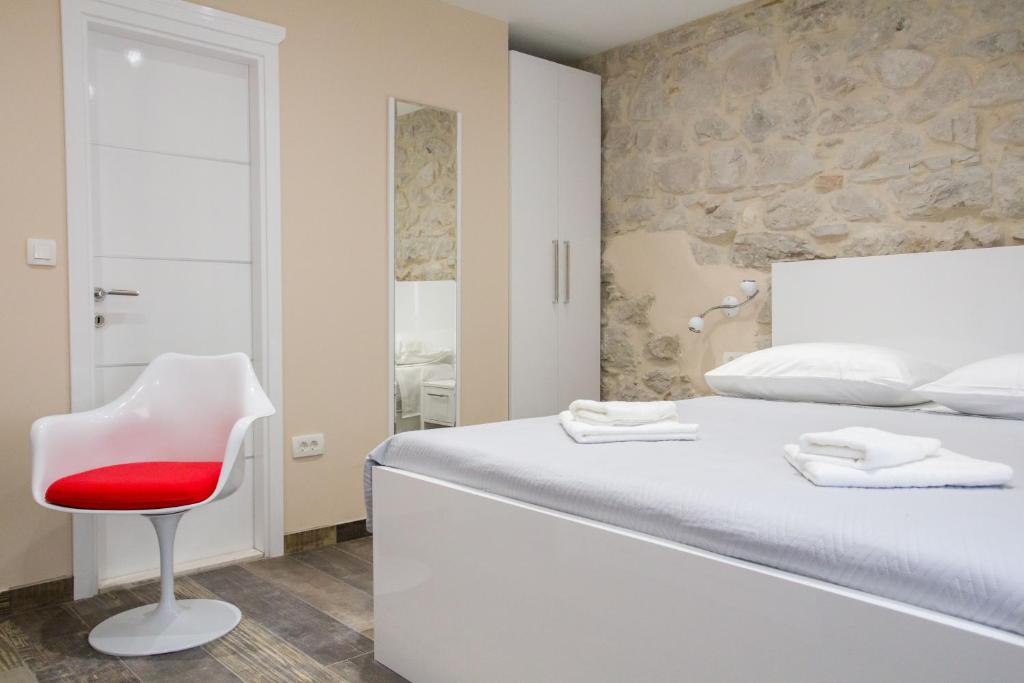 Postel nebo postele na pokoji v ubytování Elegant Residence Rooms & Apartments