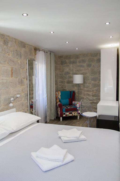 Postel nebo postele na pokoji v ubytování Elegant Residence Rooms & Apartments
