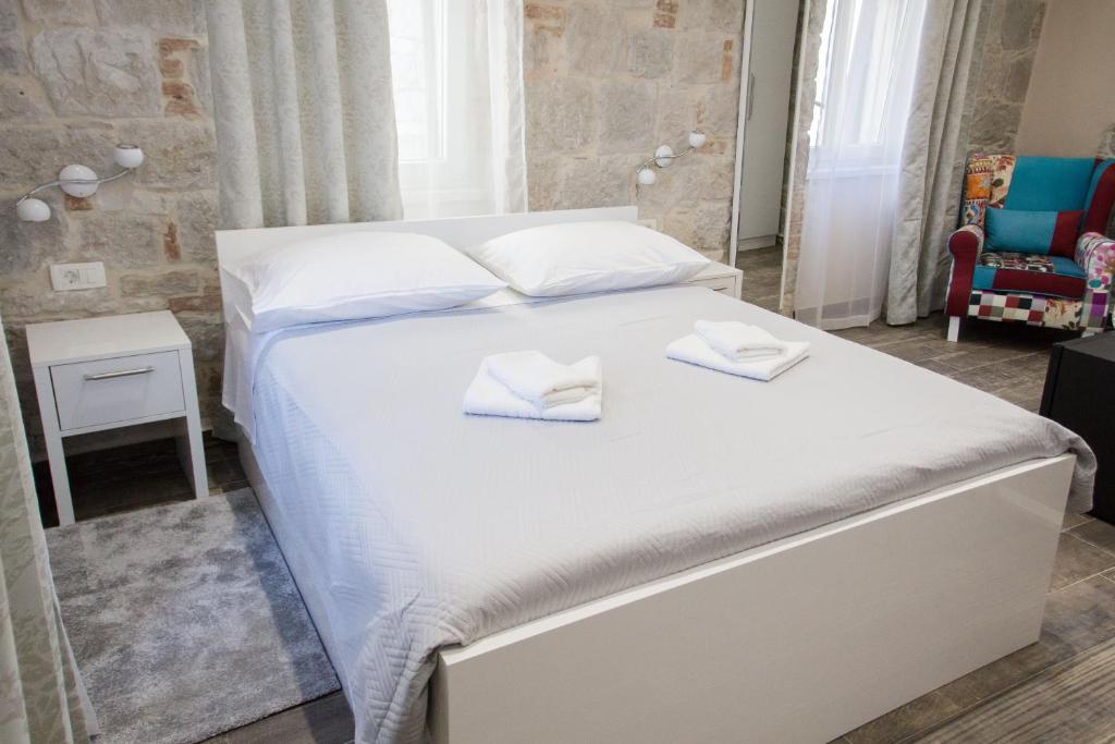 Postel nebo postele na pokoji v ubytování Elegant Residence Rooms & Apartments