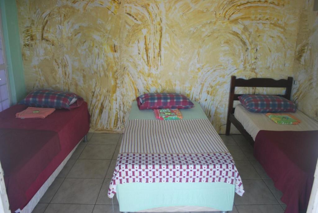 A bed or beds in a room at Hotel Palmas Tocantins