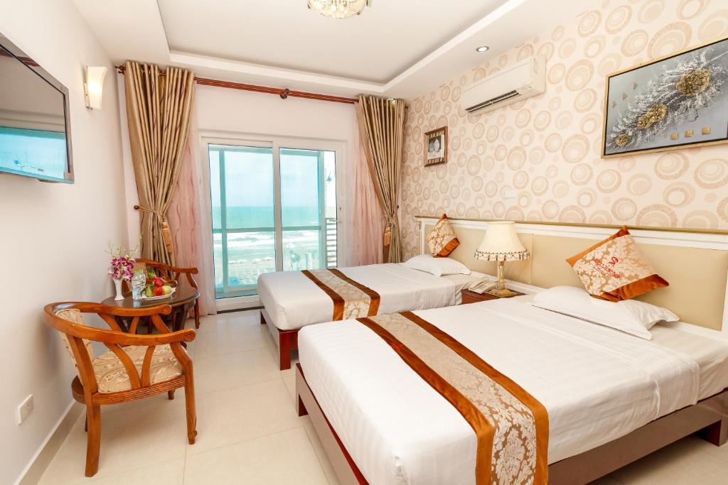 Postel nebo postele na pokoji v ubytování Romeliess Hotel