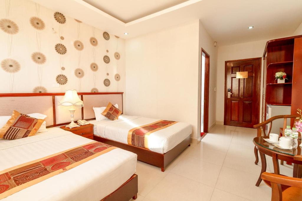 Postel nebo postele na pokoji v ubytování Romeliess Hotel