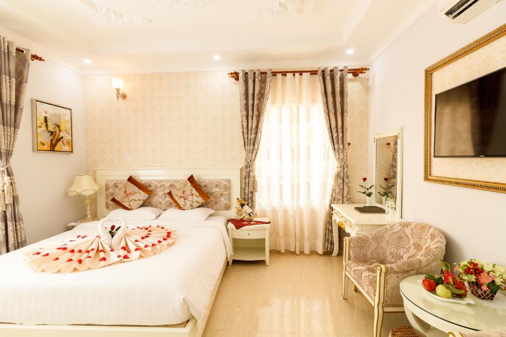 Postel nebo postele na pokoji v ubytování Romeliess Hotel