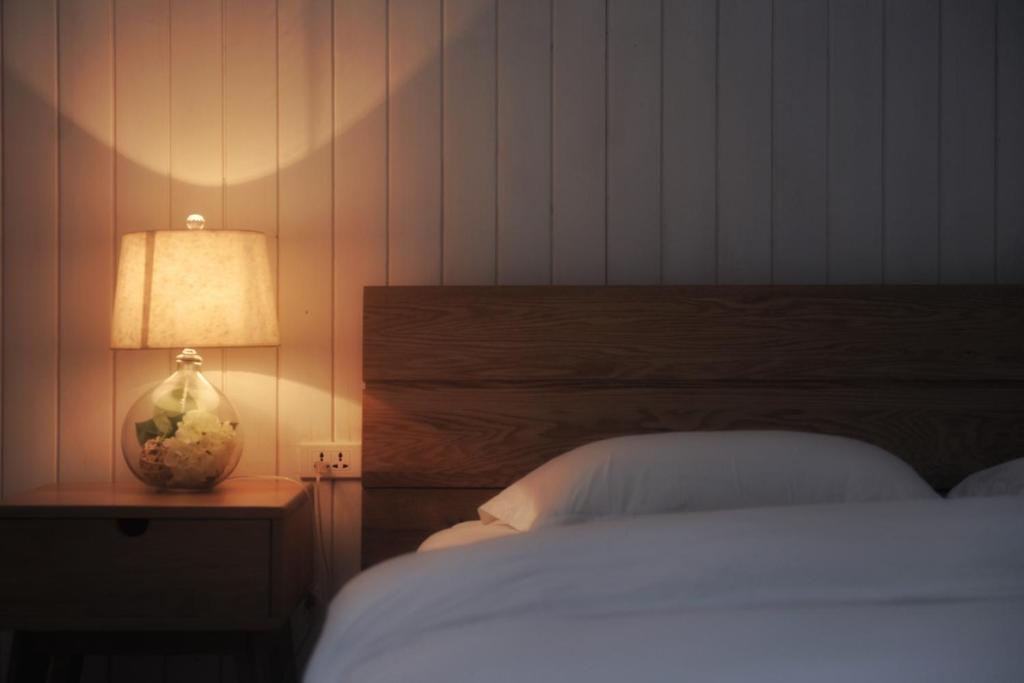 Postel nebo postele na pokoji v ubytování Zen Box House