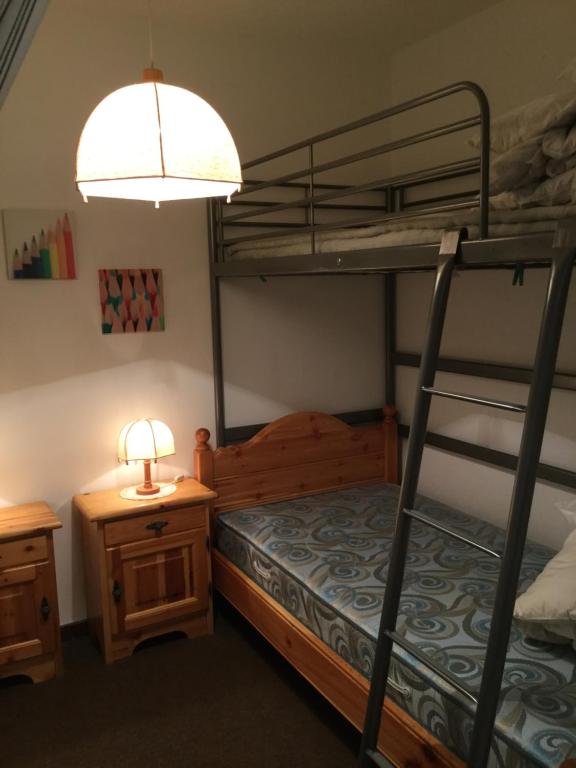 Postel nebo postele na pokoji v ubytování Disentis