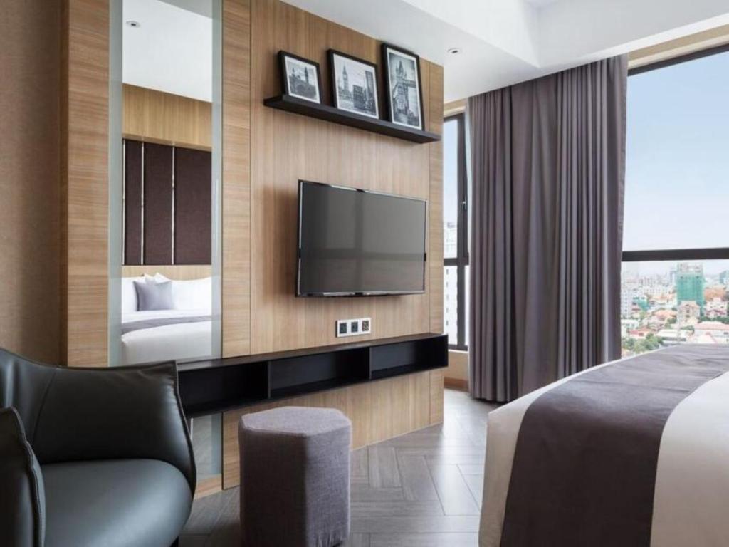 TV a/nebo společenská místnost v ubytování One Residence Hotel & Apartment