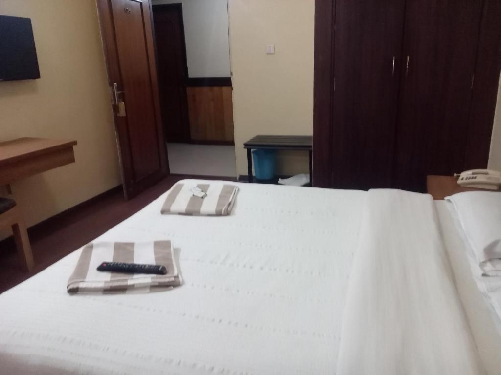 Postel nebo postele na pokoji v ubytování Hotel Preethi Palace