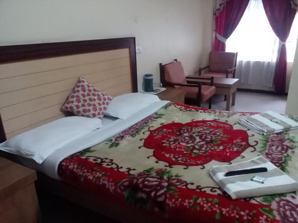 Postel nebo postele na pokoji v ubytování Hotel Preethi Palace