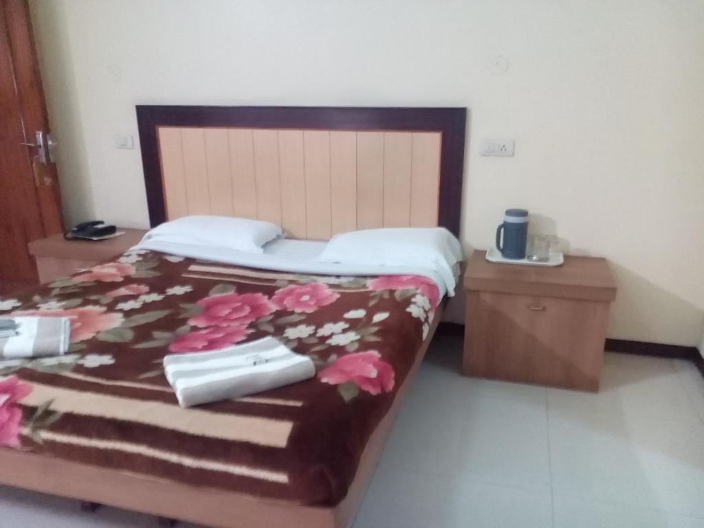 Postel nebo postele na pokoji v ubytování Hotel Preethi Palace