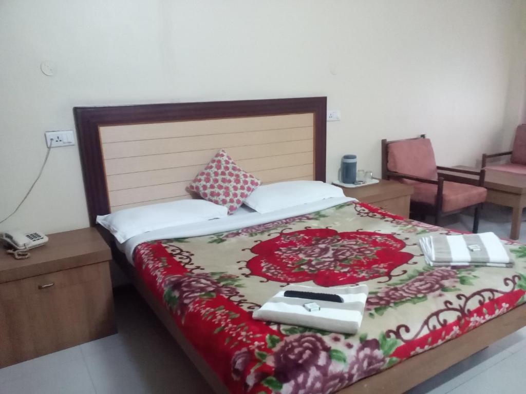 Postel nebo postele na pokoji v ubytování Hotel Preethi Palace