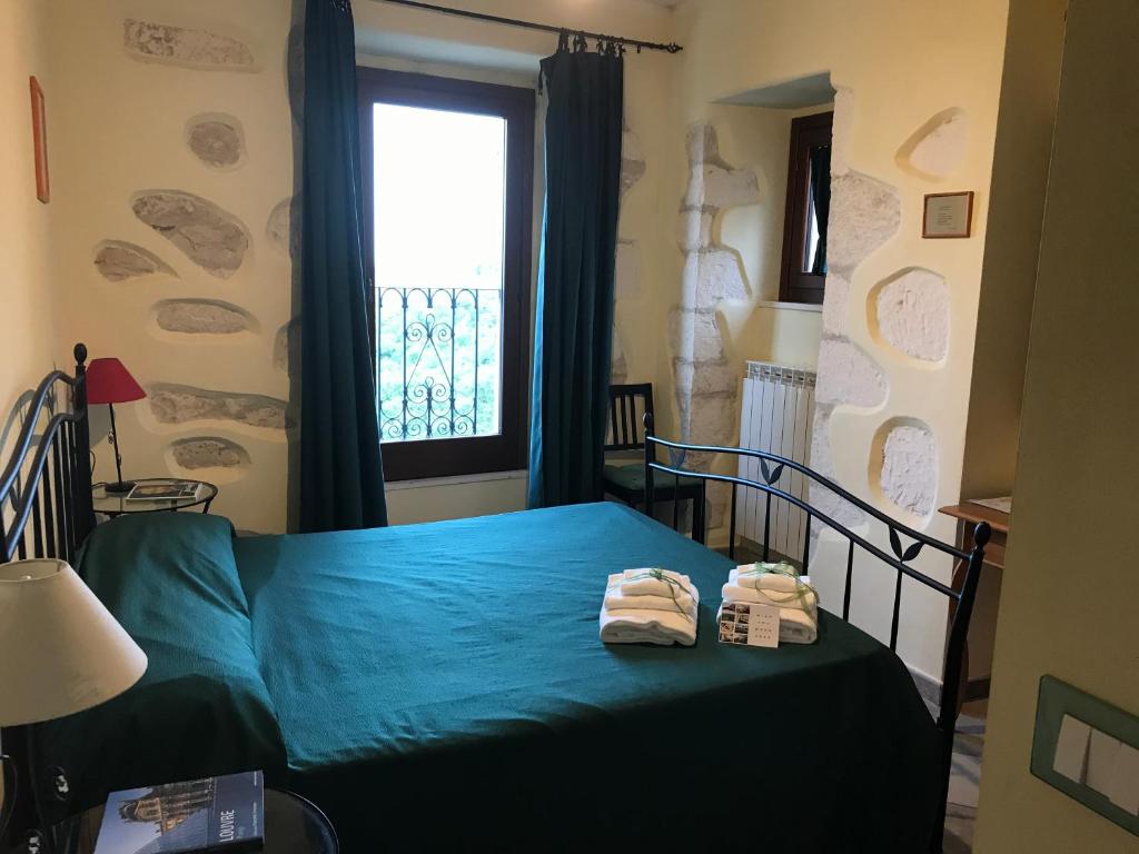 Postel nebo postele na pokoji v ubytování B&B Casa Mila'