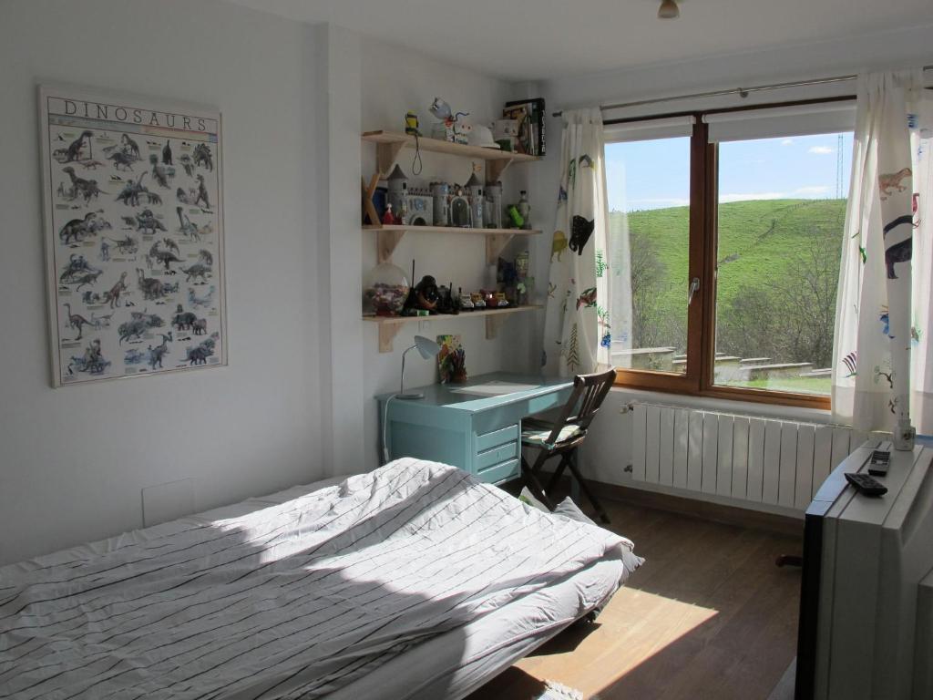 Postel nebo postele na pokoji v ubytování Belvilla by OYO Villa Villaverde