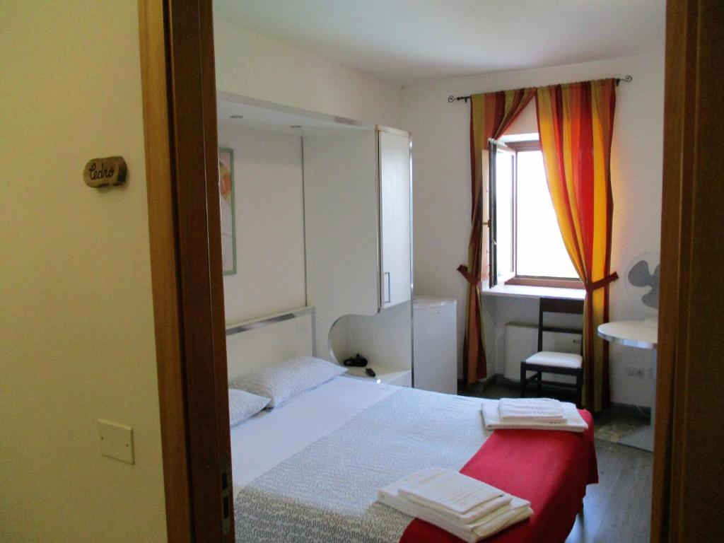 Postel nebo postele na pokoji v ubytování Colle Sul Lago