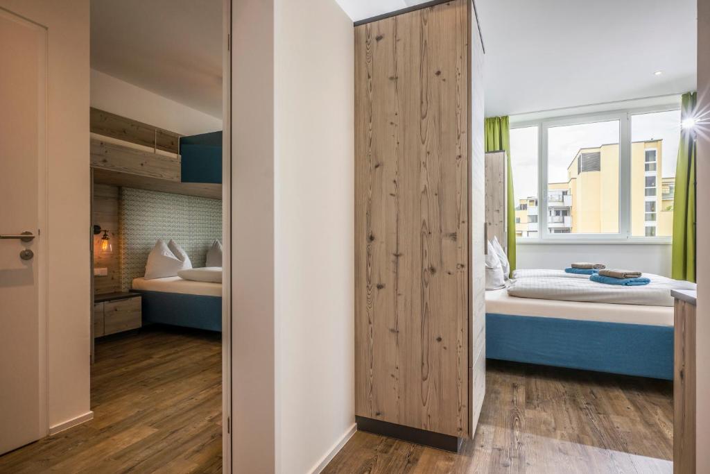 Posteľ alebo postele v izbe v ubytovaní Aparthotel Backstage