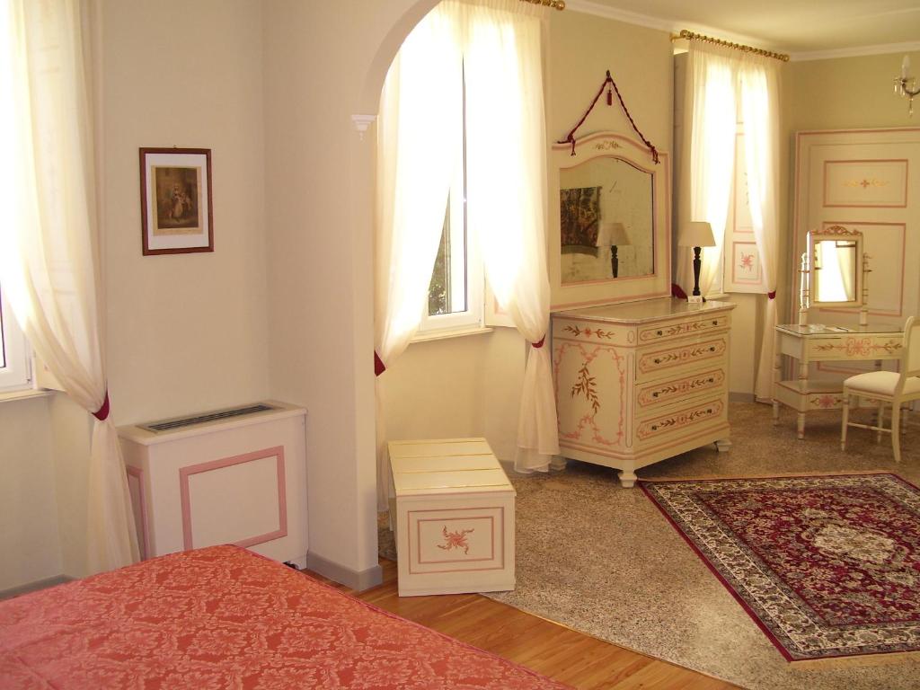 Postel nebo postele na pokoji v ubytování Villa La Mirabella