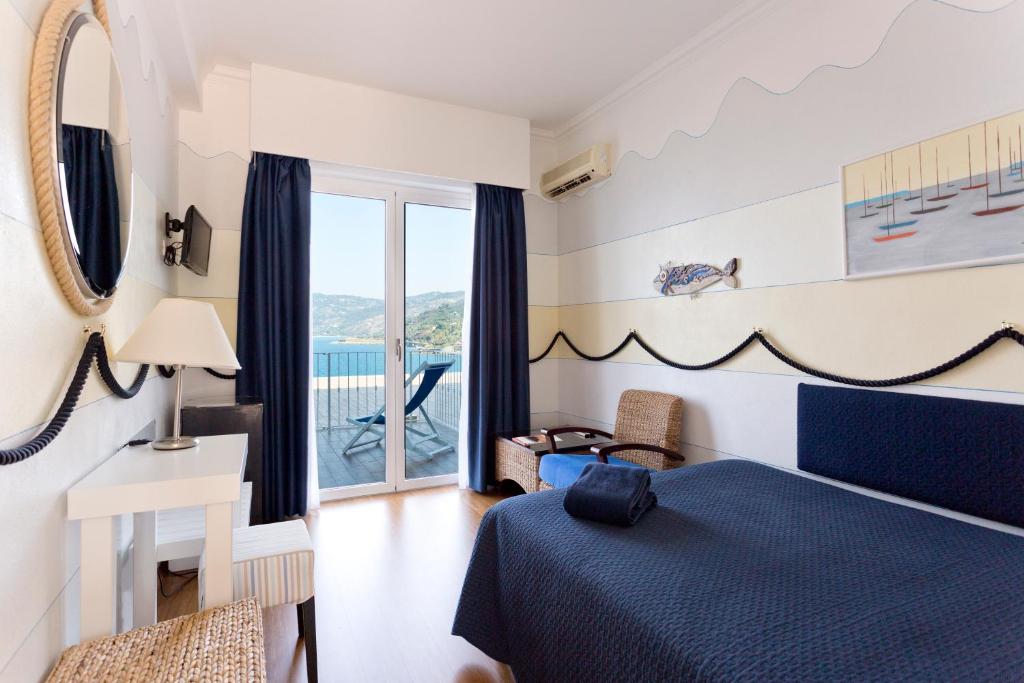 Кровать или кровати в номере Hotel Kalura