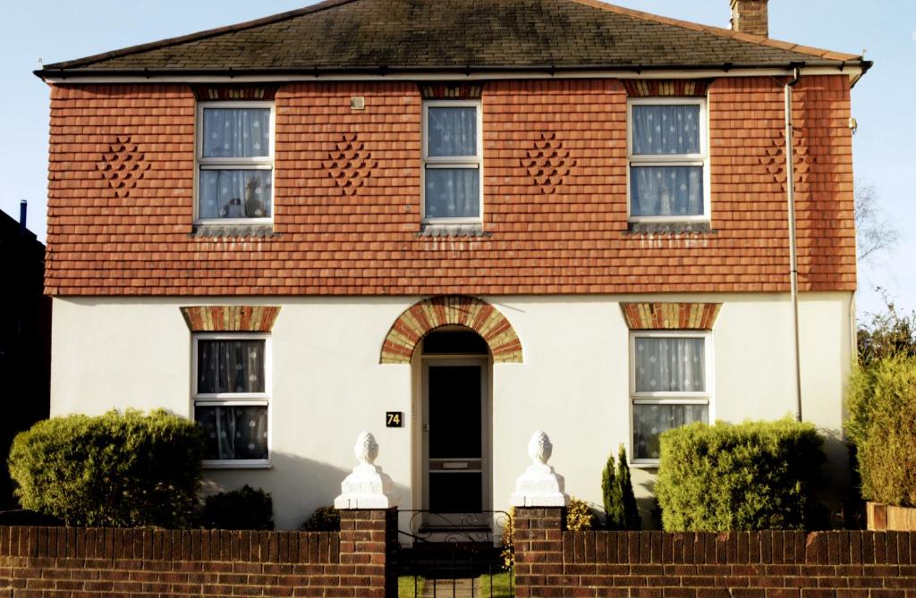 a house with a red roof at Park Lodge in Farnborough