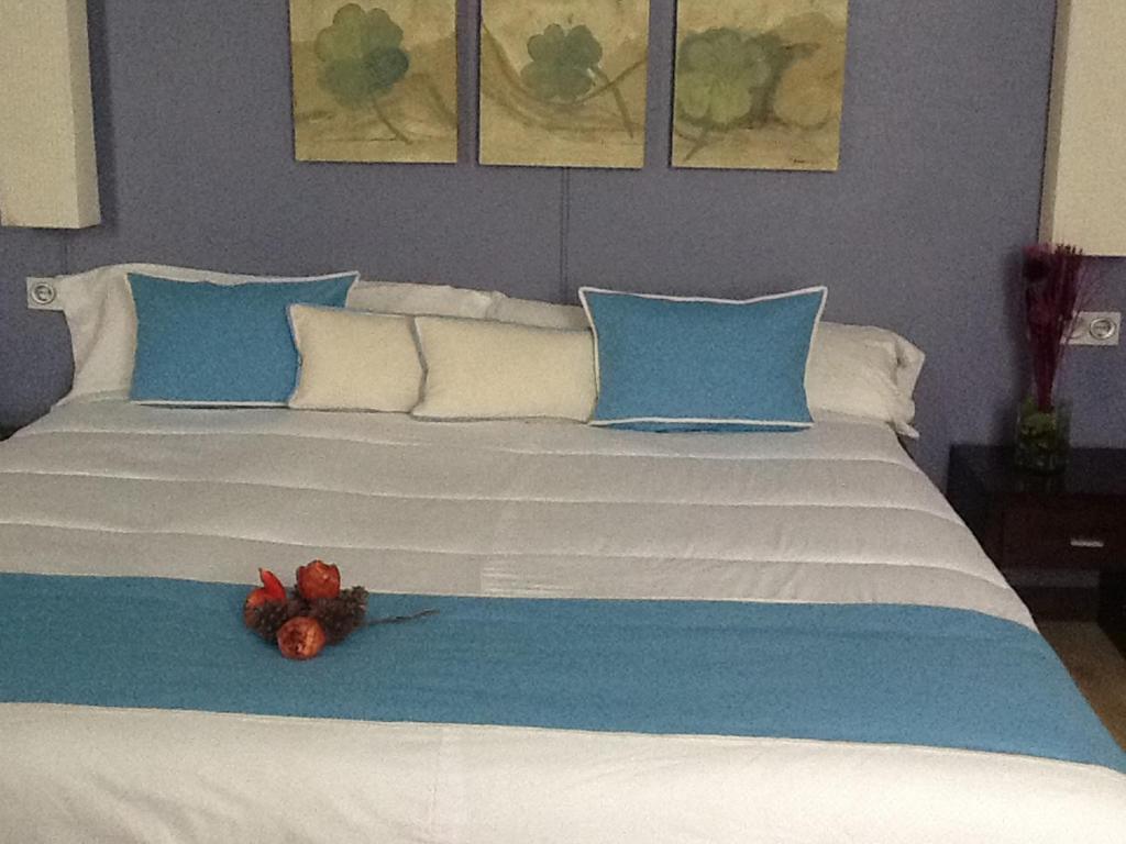 Postel nebo postele na pokoji v ubytování Hotel Puerta de Ocaña