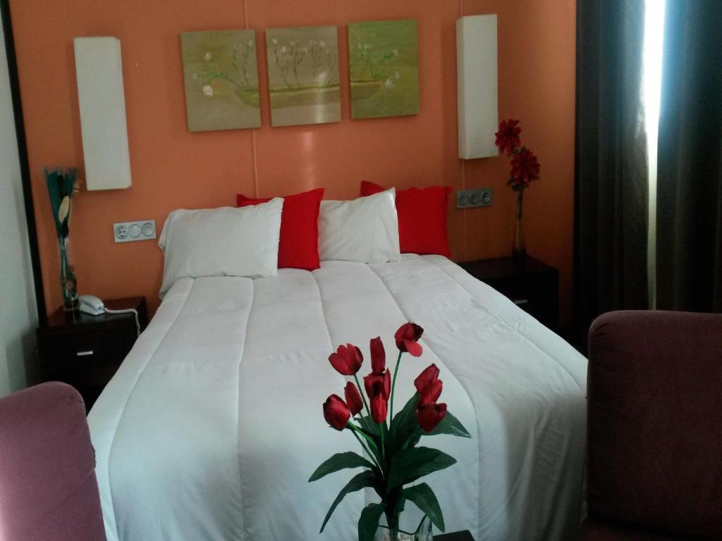 Postel nebo postele na pokoji v ubytování Hotel Puerta de Ocaña