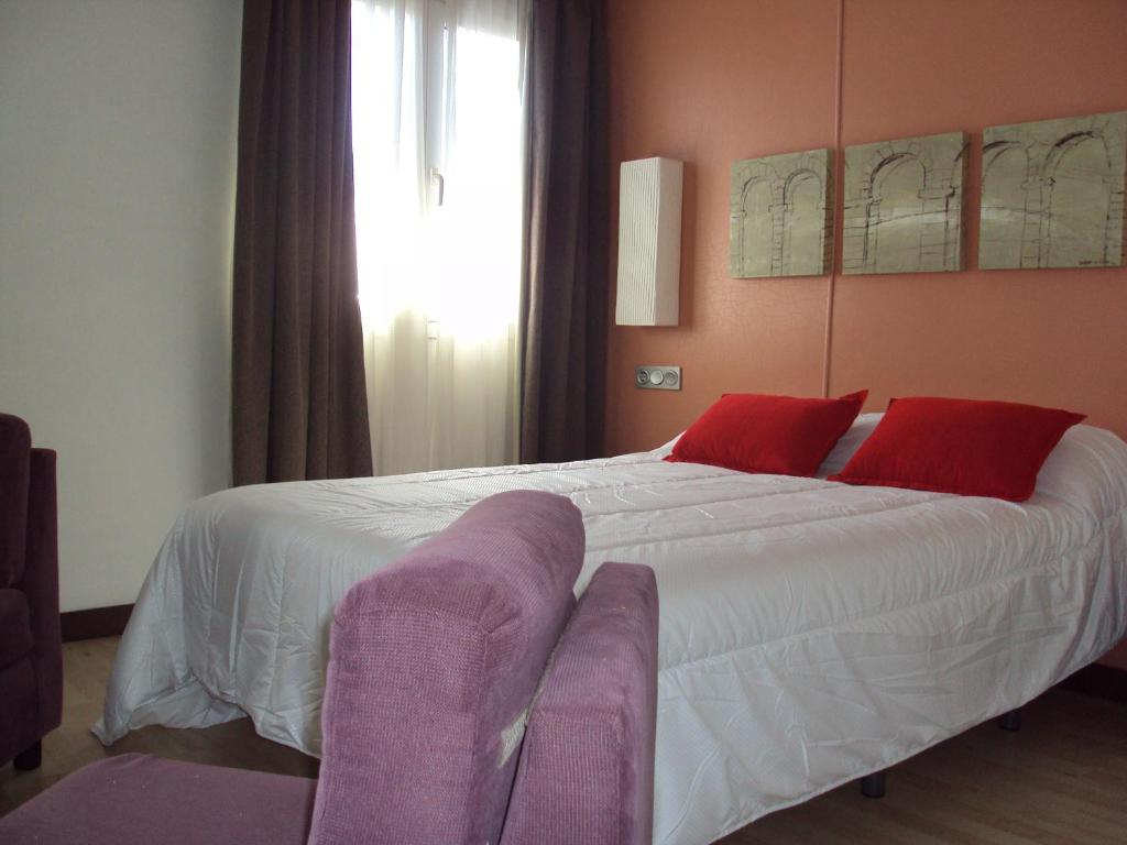Postel nebo postele na pokoji v ubytování Hotel Puerta de Ocaña